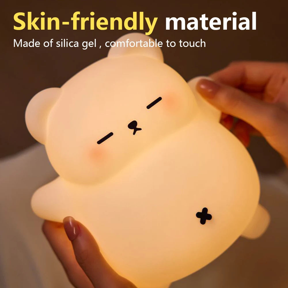 Cute animal-shaped kawaii night light held by a hand with text about skin-friendly material.