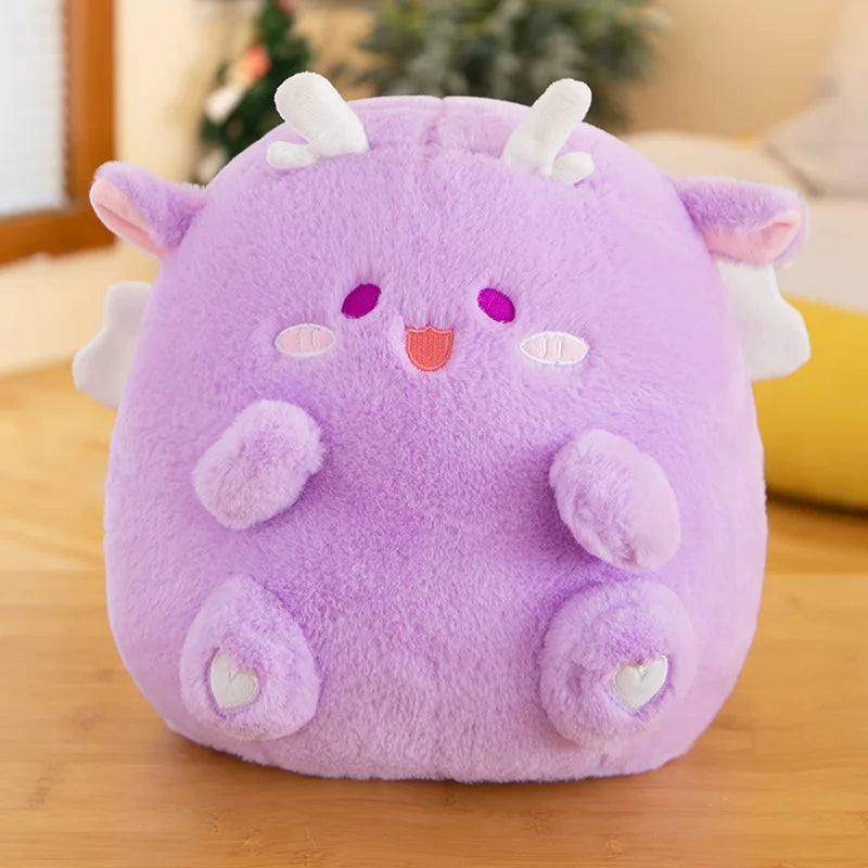 Purple kawaii plush toy with white accents on a wooden surface