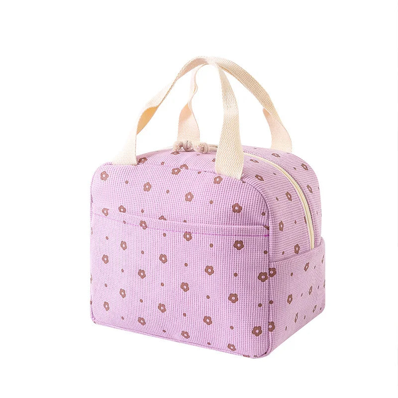 Purple lunch bag with kawaii floral pattern on a white background