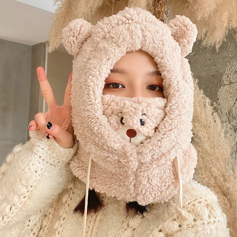 Person wearing a Kawaii fluffy bear-themed hood with a neutral background