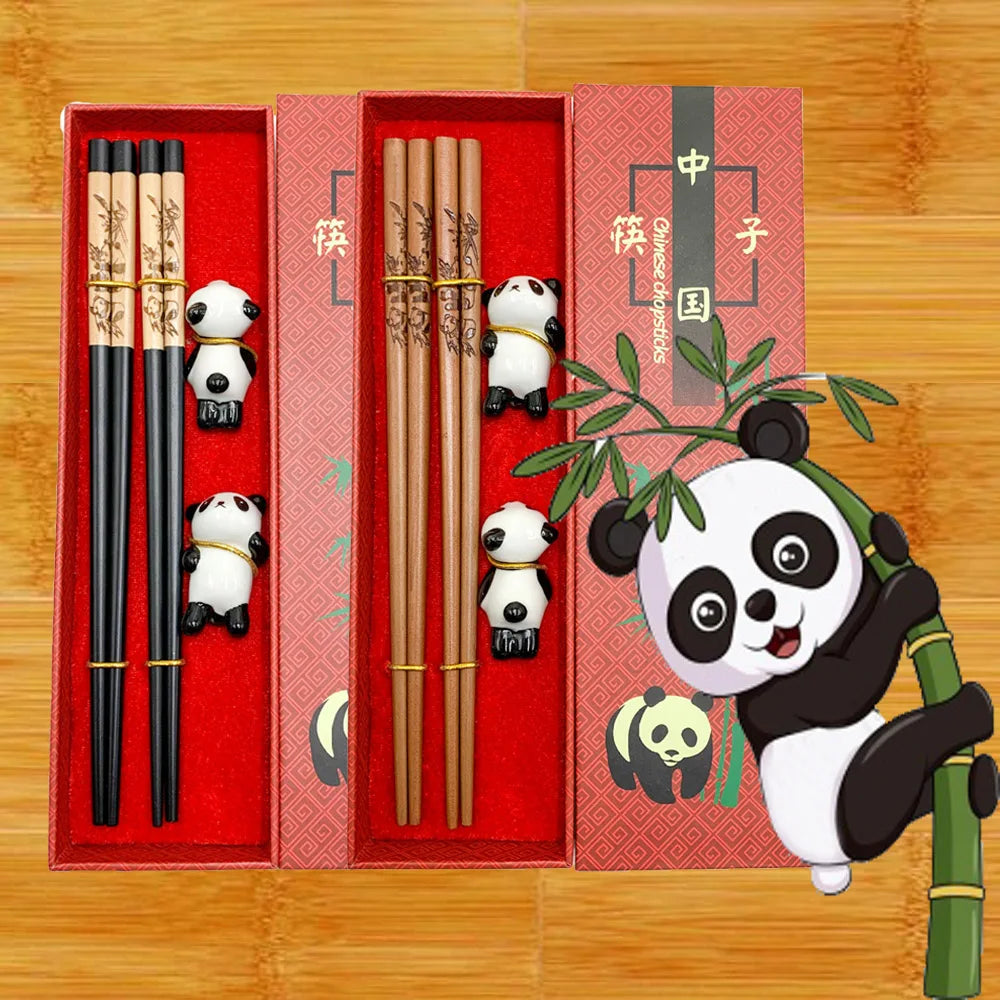 Set of chopsticks with kawaii panda characters in a red box on a wooden background