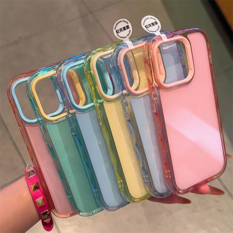 Five colorful kawaii phone cases on a hand with a blurred background