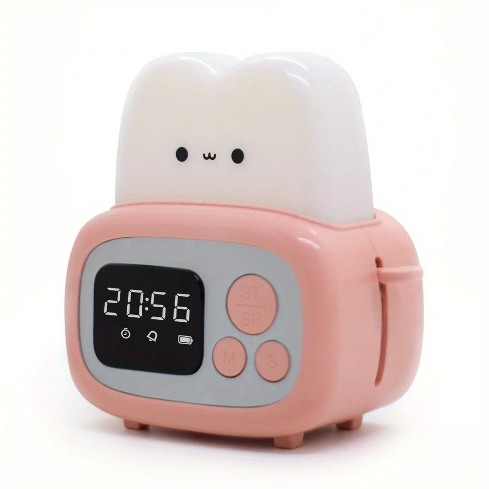 Pink kawaii night light with a digital display and cartoon face on a white background
