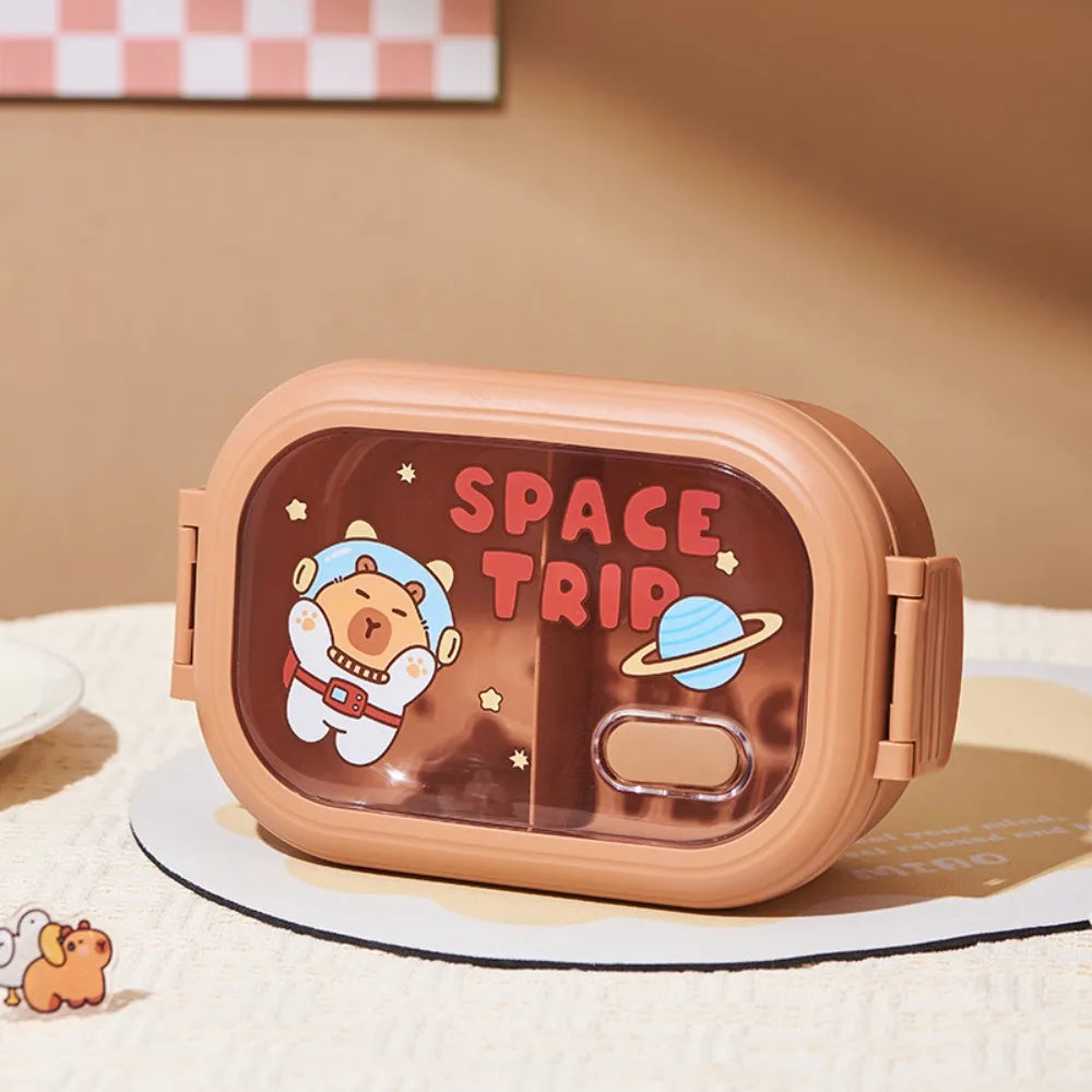 Children's kawaii lunch box with space-themed design on a beige background