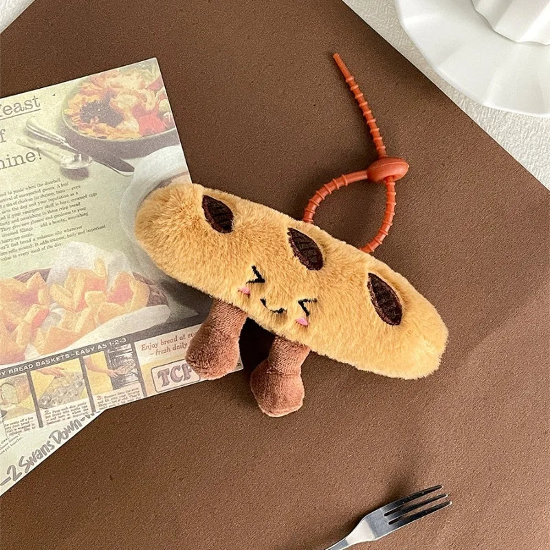 Plush kawaii toy resembling a cartoon character on a brown surface with a newspaper and fork.