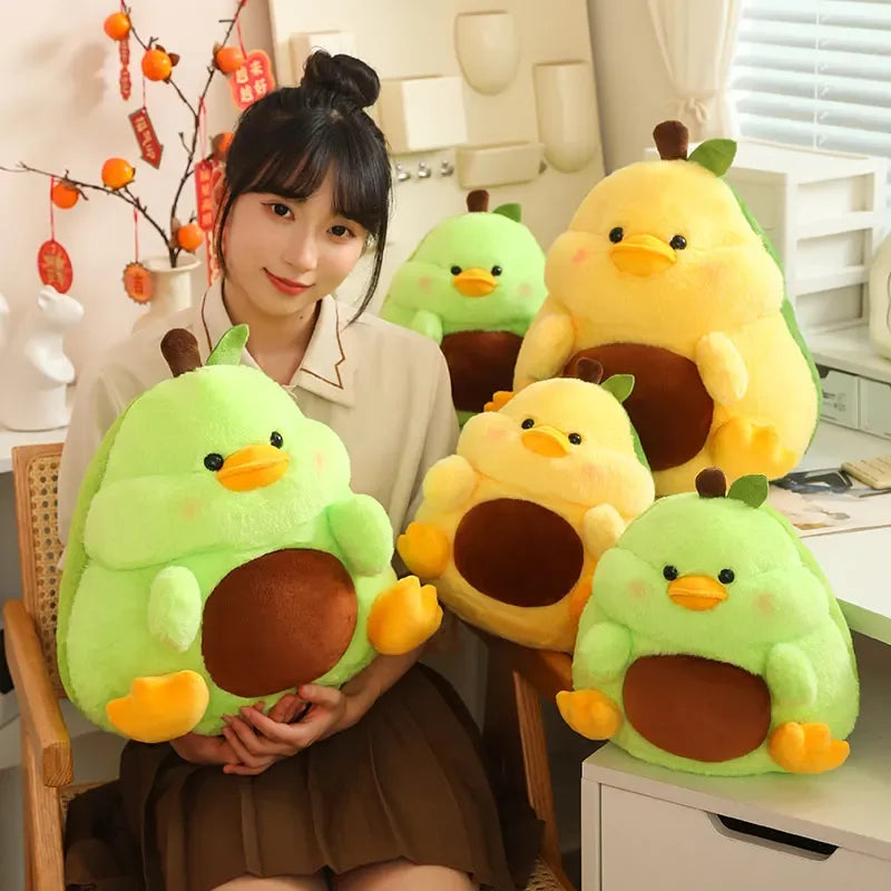 Person holding kawaii plush avocado and chick toys in a room with decorative items.