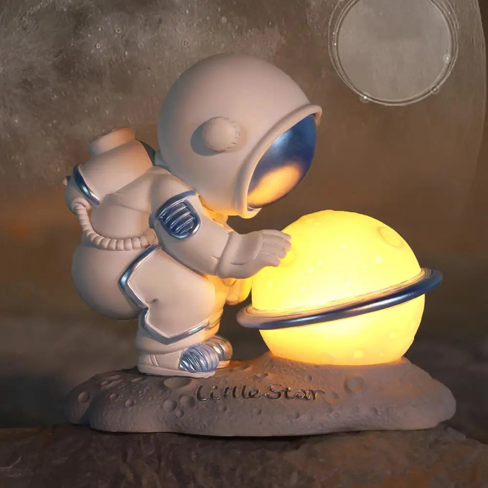 Decorative kawaii  figurine of an astronaut holding a glowing sphere on a textured surface with moon in the background.