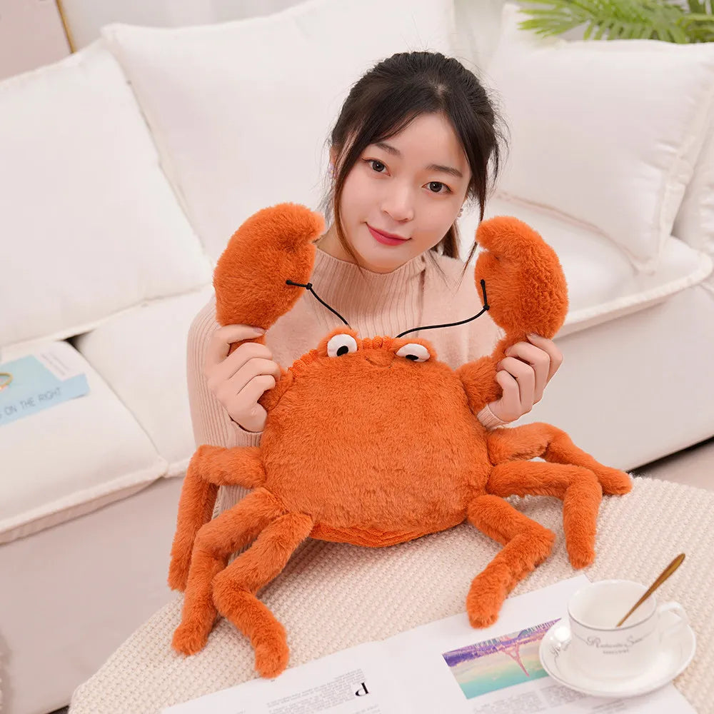 Person holding a large orange kawaii plush crab toy on a couch