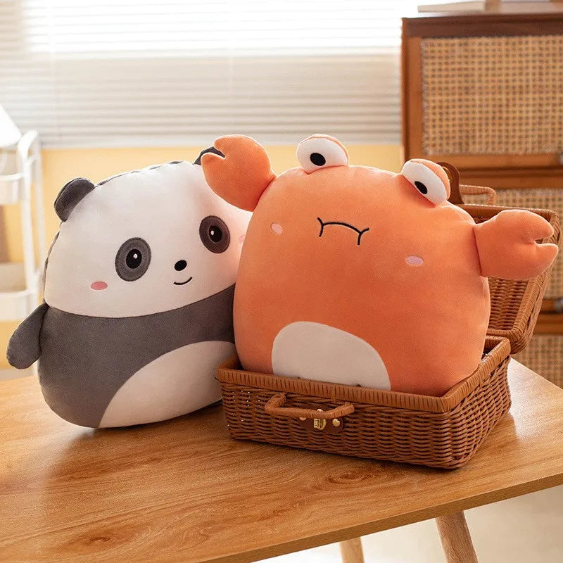 Two kawaii plush toys, one panda and one orange creature, in a wicker basket on a wooden table.