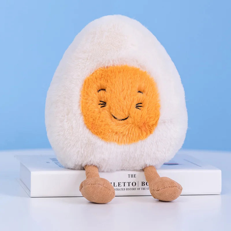Plush kawaii toy resembling a boiled egg with a smiling face on a blue background