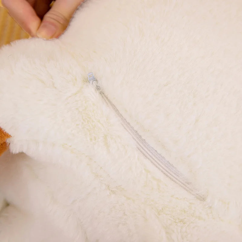 Close-up of a white plush kawaii toy with a zipper, held by a hand.