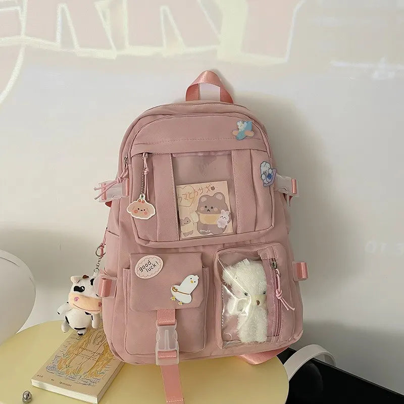 Kawaii pink backpack with decorative elements on a white background