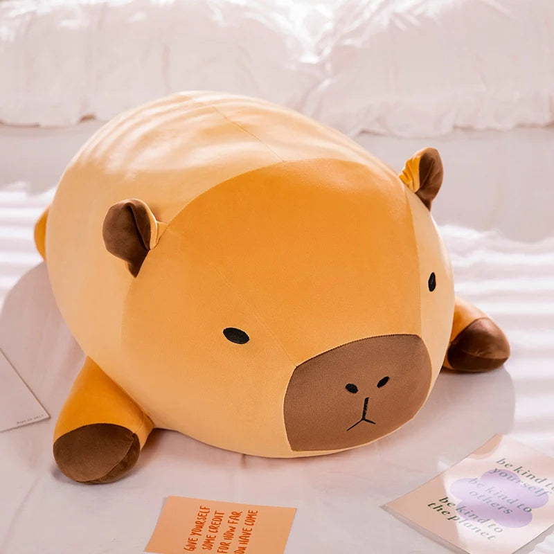 Cute animal-shaped kawaii pillow on a bed with a soft background