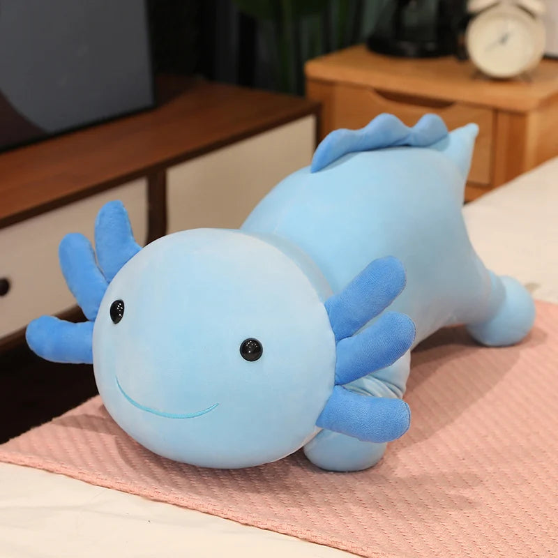Blue axolotl plush kawaii toy on a pink blanket