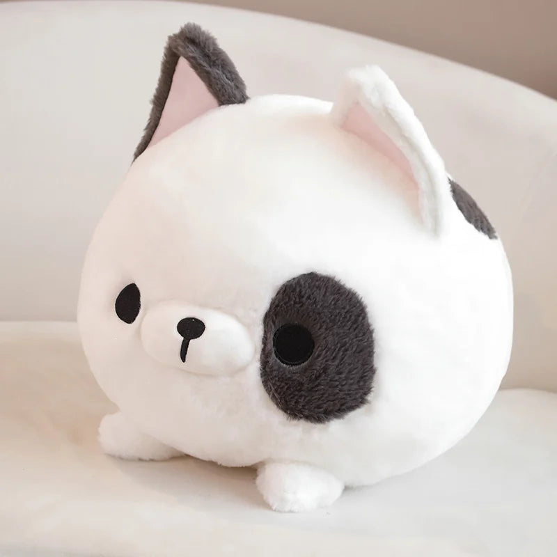 Cute kawaii plush toy resembling a cat with a white body and gray ears on a light background