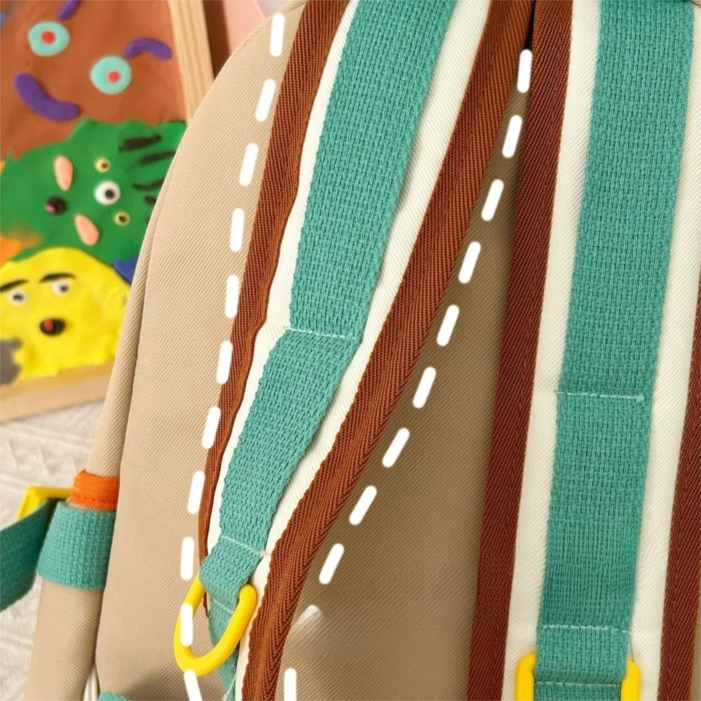 Close-up of colorful straps with a Kawaii cartoon character in the background