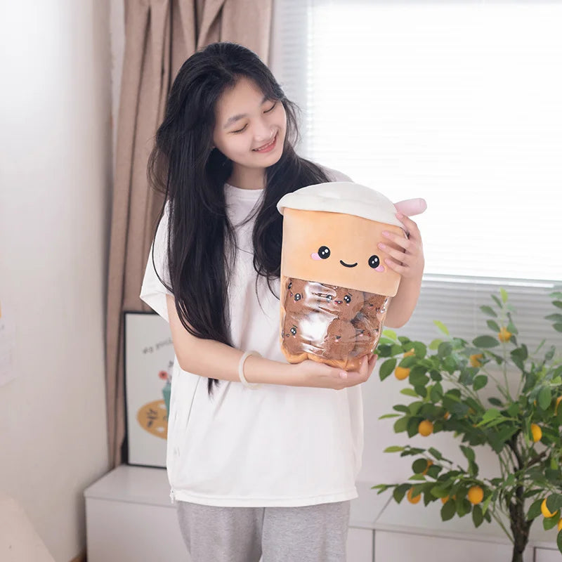 Woman holding a brown kawaii boba tea plush toy