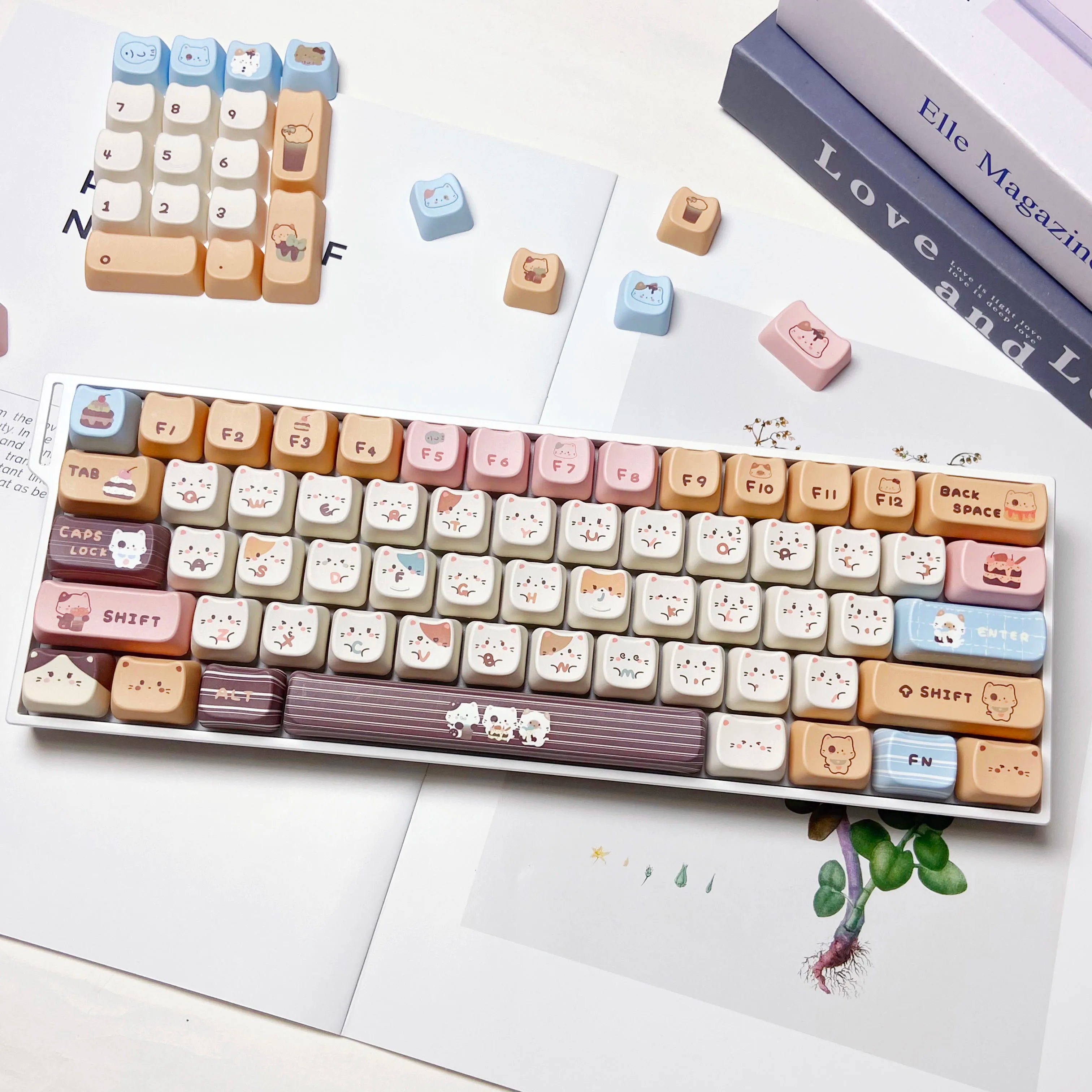 Keyboard with Kawaii keycaps on a white surface