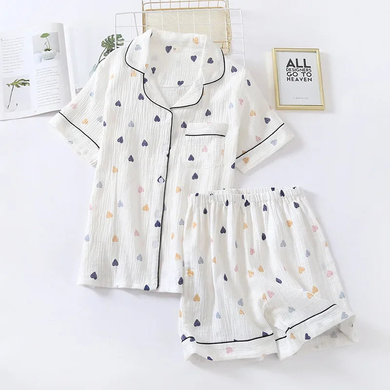 White pajama set with heart kawaii patterns on a white background