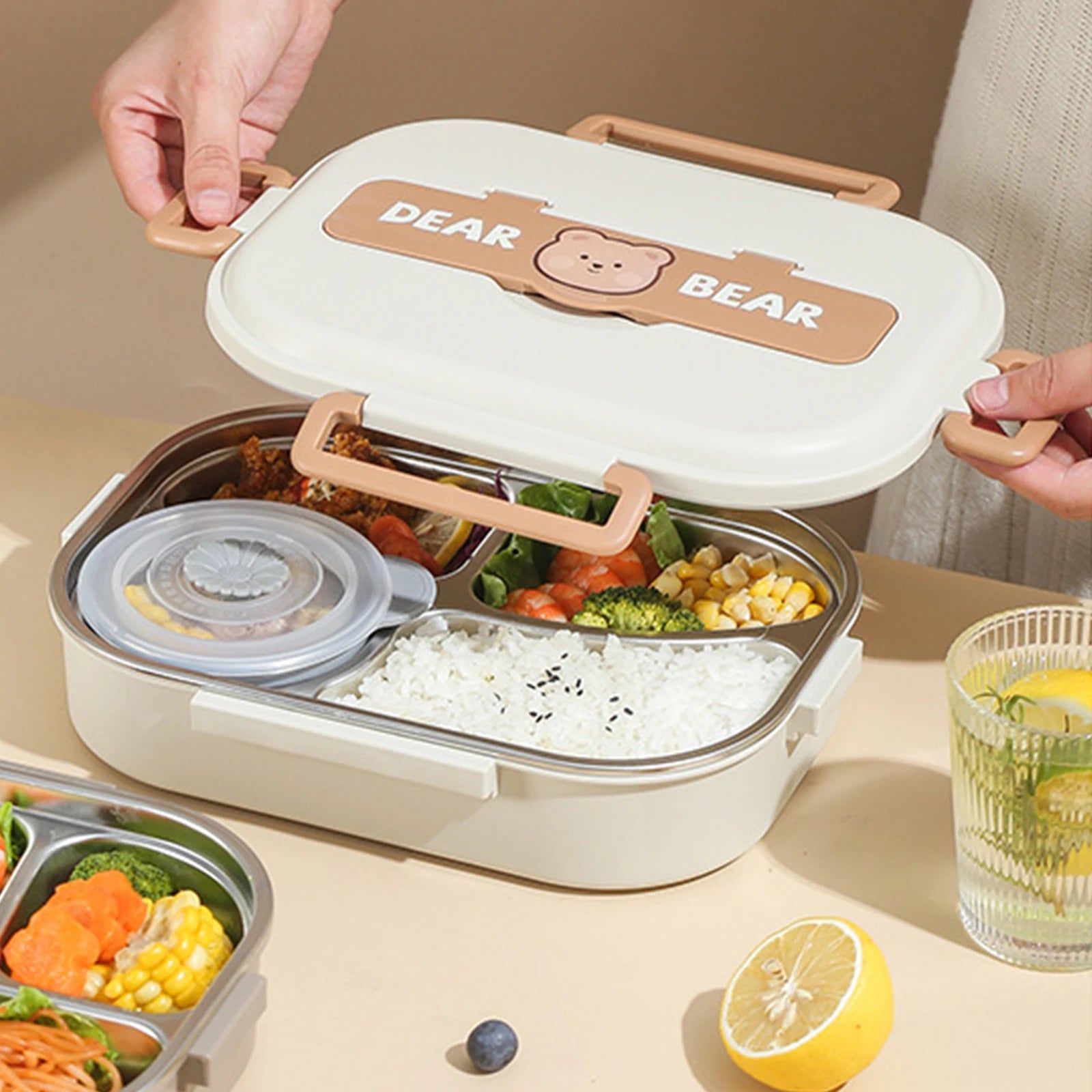 Kawaii lunch box with compartments filled with food on a table