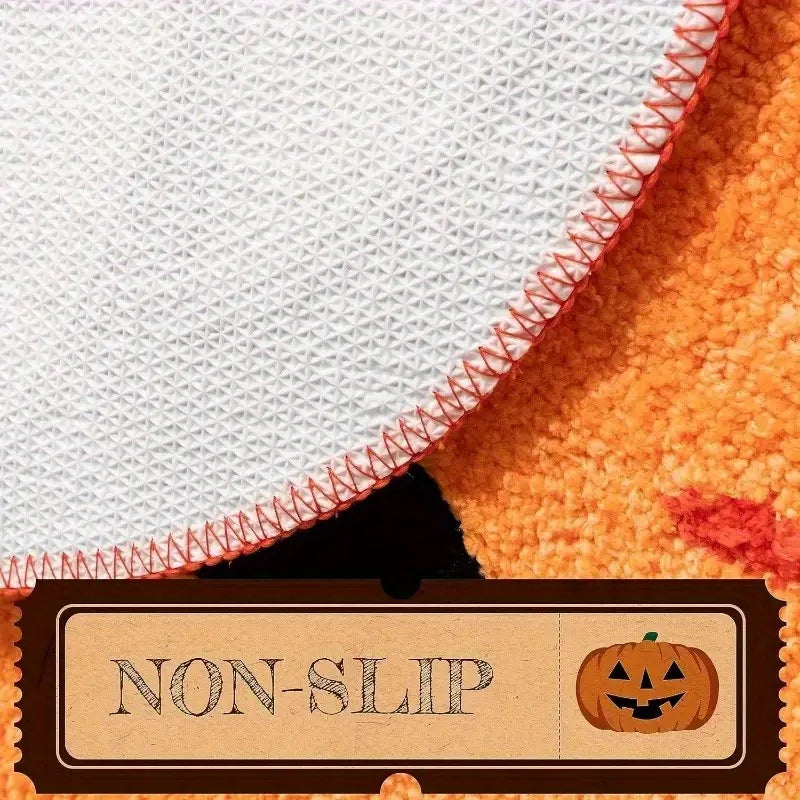 Textile with a non-slip label and Kawaii pumpkin design on an orange and white background