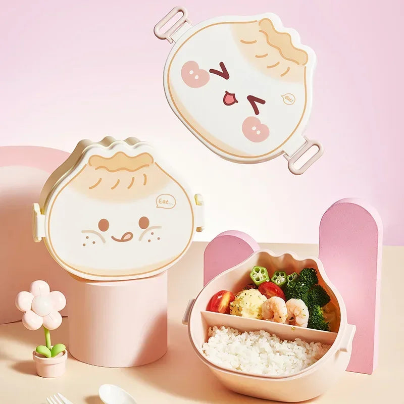 Cute kawaii bento box with cartoon face design on a pink background