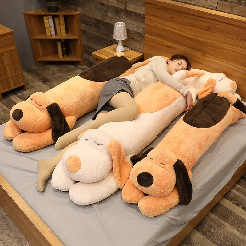 Woman lying down next to three Kawaii dog plushies