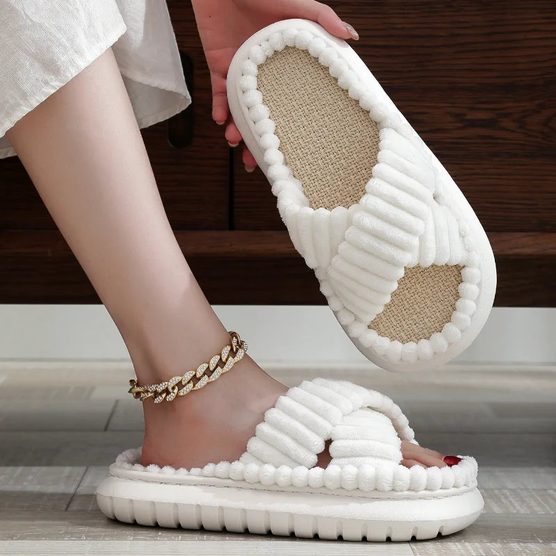 White kawaii slippers with textured sole worn indoors on a wooden floor.