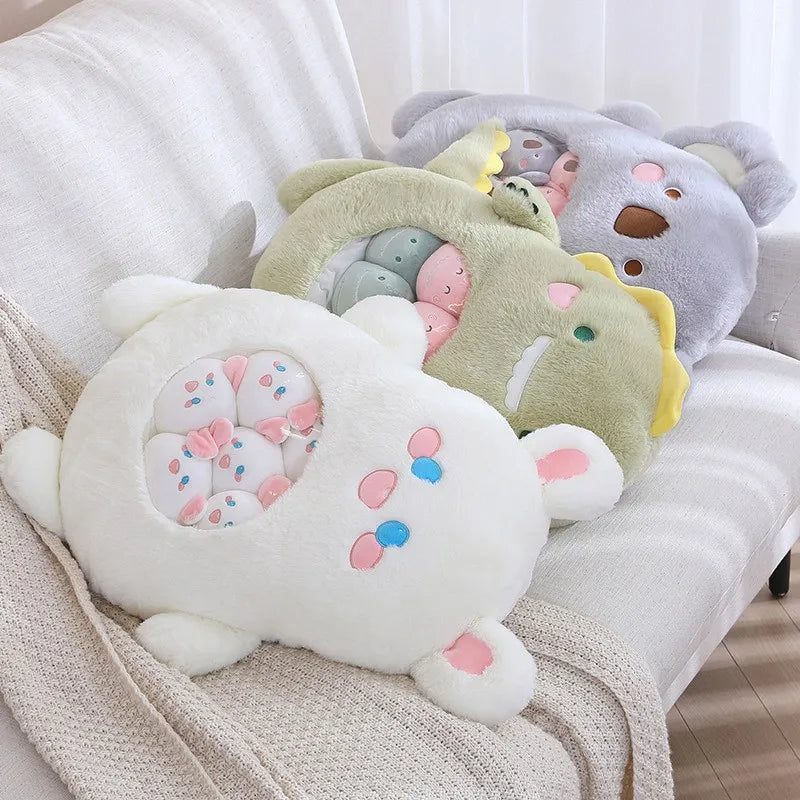 Kawaii plush toys resembling cartoon characters on a white surface