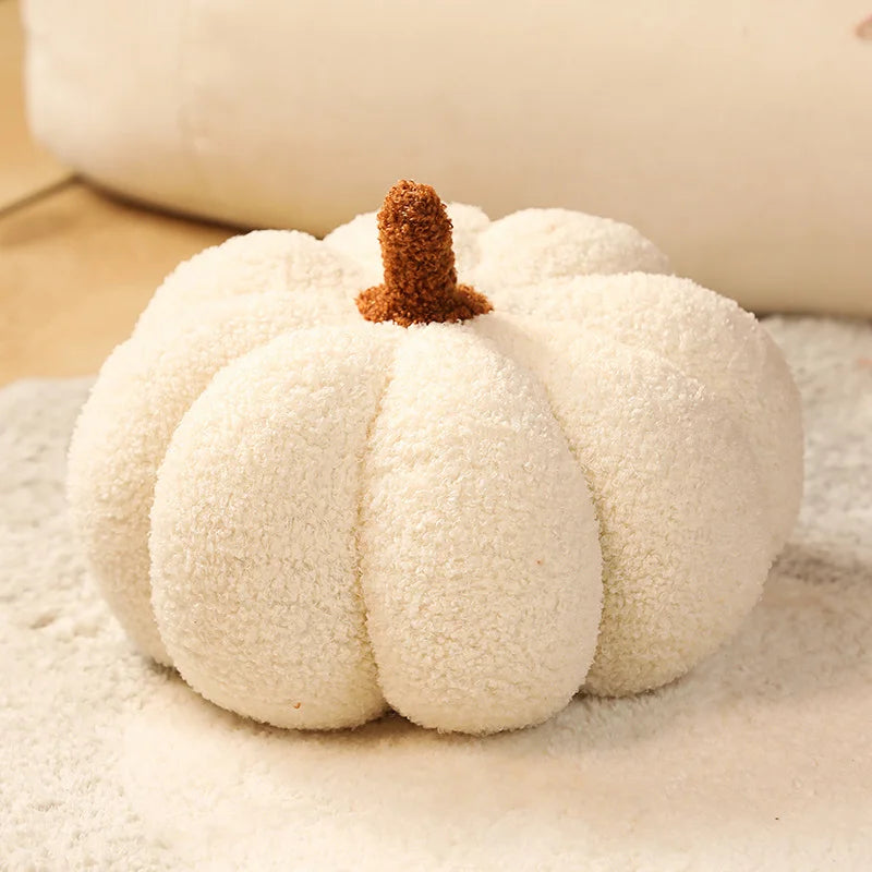 White kawaii pumpkin with a brown stem on a textured surface