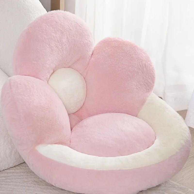 Pink and white plush heart-shaped kawaii pillow on a light surface with a blurred background