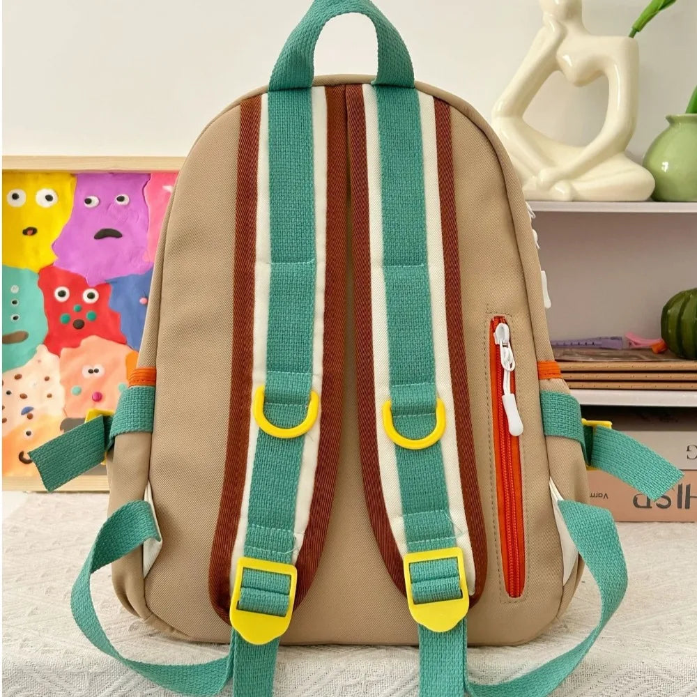Kawaii beige backpack with colorful straps and accents on a neutral background
