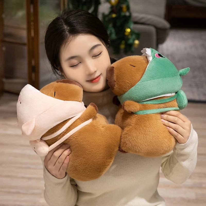 Woman holding two kawaii plush toys, one brown and one green, in a cozy indoor setting.