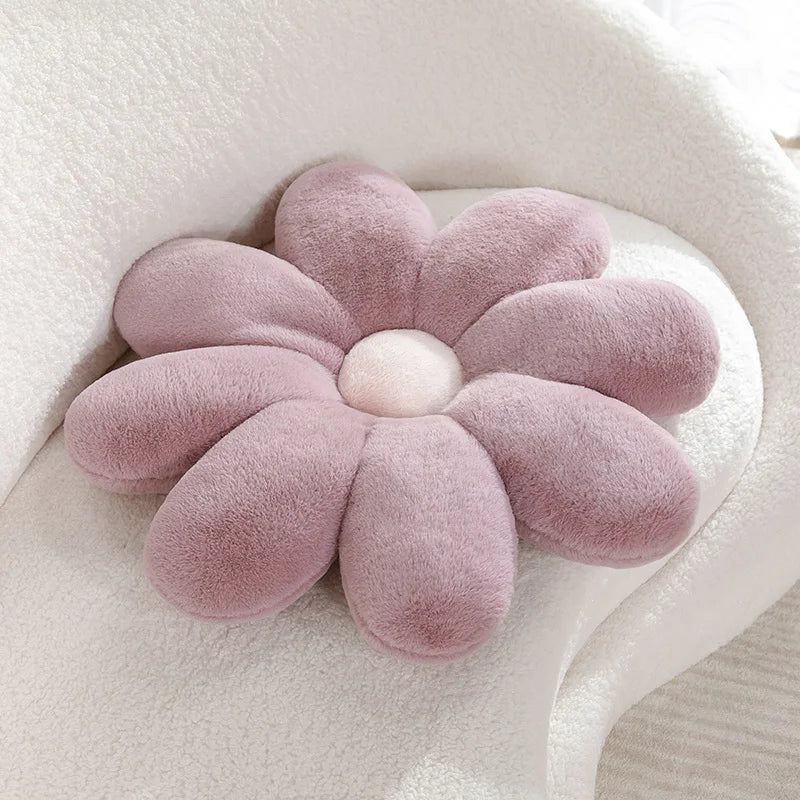 Flower-shaped pink Kawaii cushion on a white surface