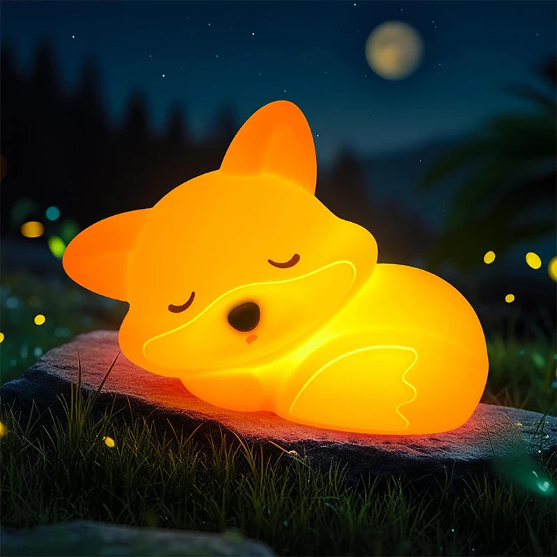 Fox-shaped kawaii night light glowing in a nighttime outdoor setting with stars.