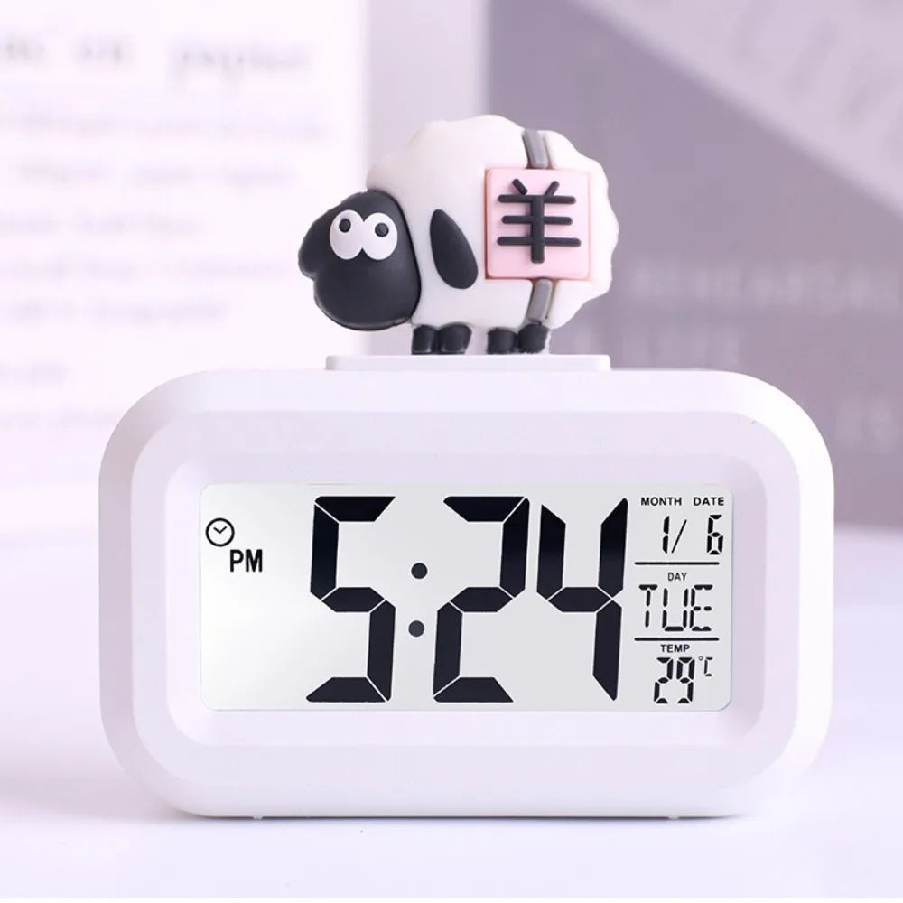 Kawaii digital clock with a sheep-shaped decoration on a white background