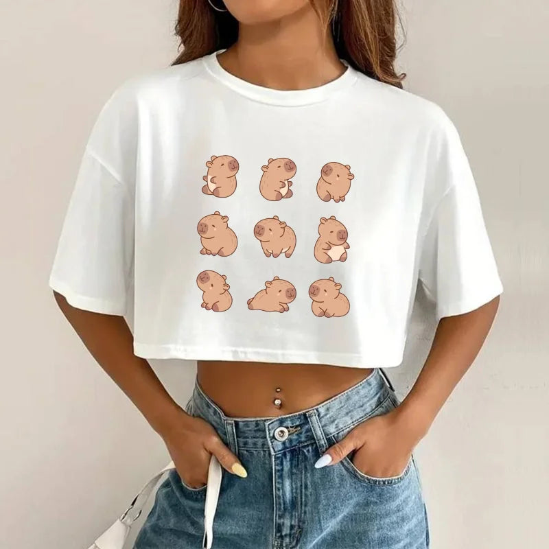 Person wearing a white t-shirt with cartoon kawaii capybara designs and blue jeans against a plain background