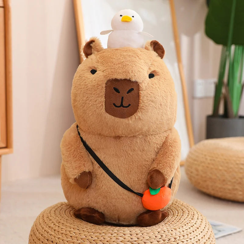 Plush kawaii toy resembling a bear with a duck on its head, sitting on a woven stool.
