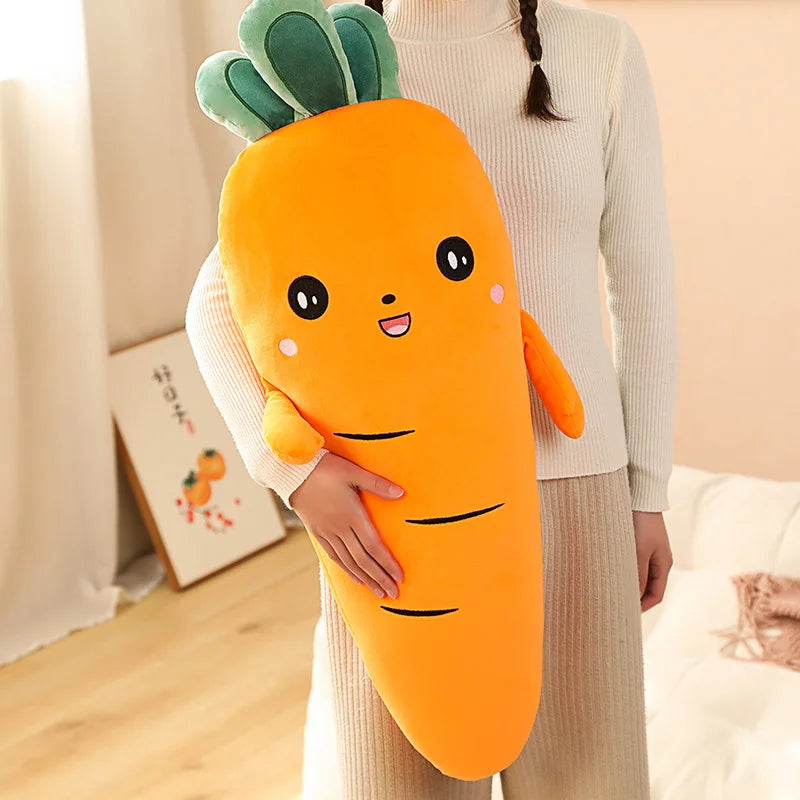 Person holding a large carrot-shaped kawaii plush toy in a room with a light-colored wall and wooden floor.
