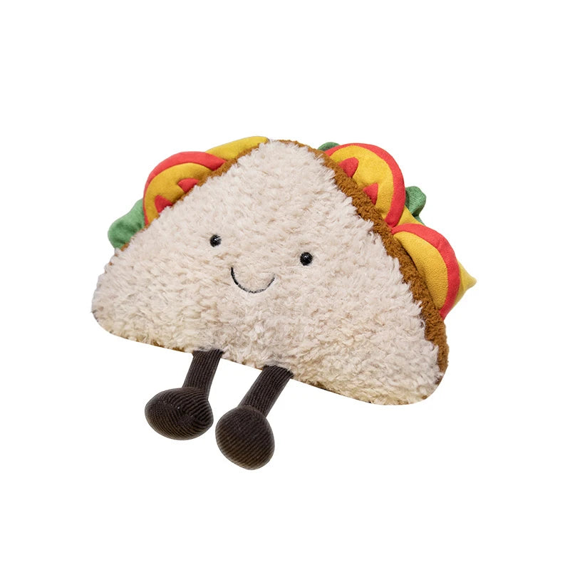 Plush kawaii toy shaped like a taco with a smiling face on a white background