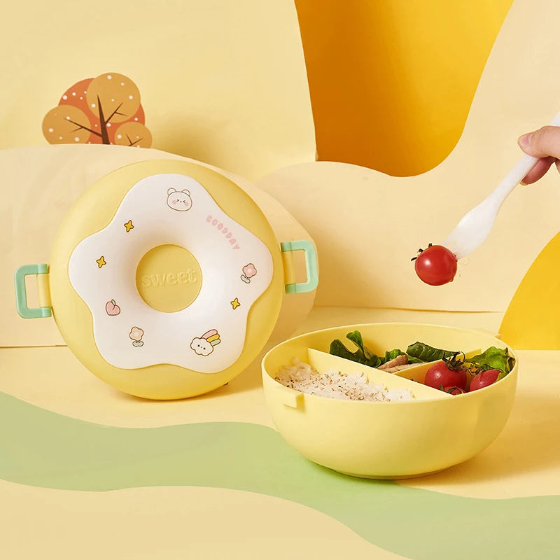 Yellow kawaii children's lunch box with a bowl of food and a fork on a yellow background