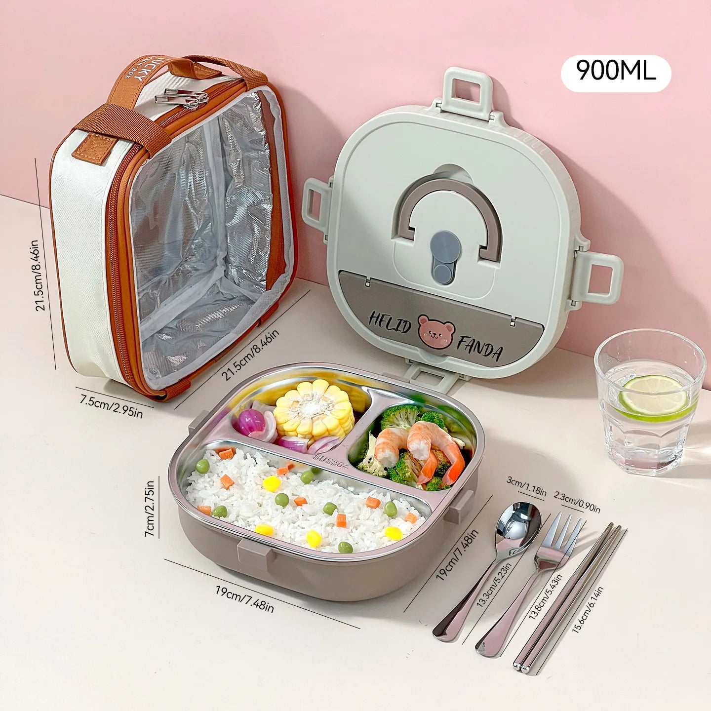 Kawaii lunch box with compartments, utensils, and a glass of water on a pink background