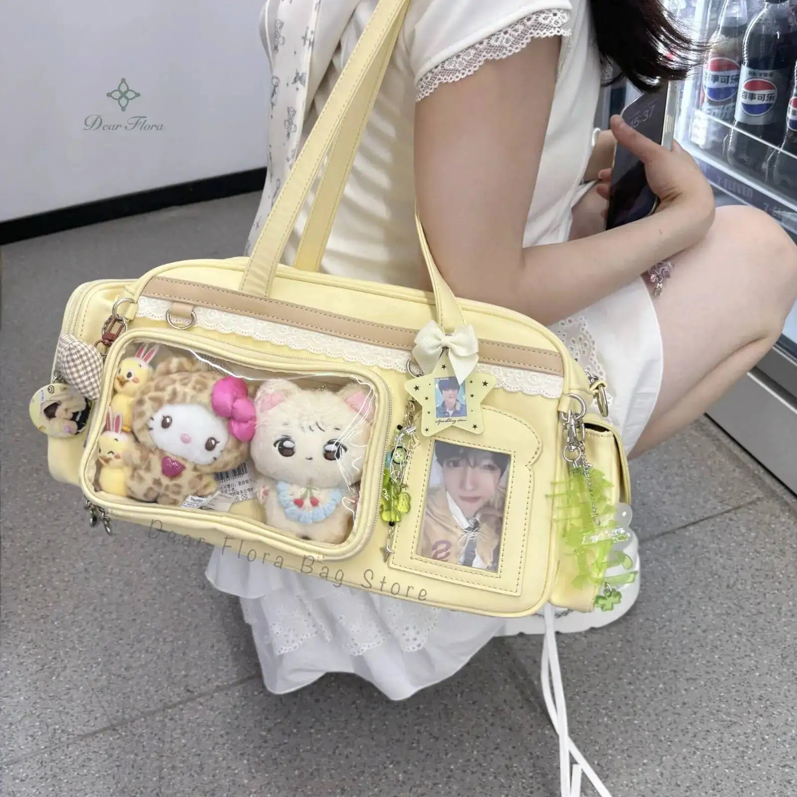 Light yellow Kawaii handbag with decorative elements held by a person in a white dress.