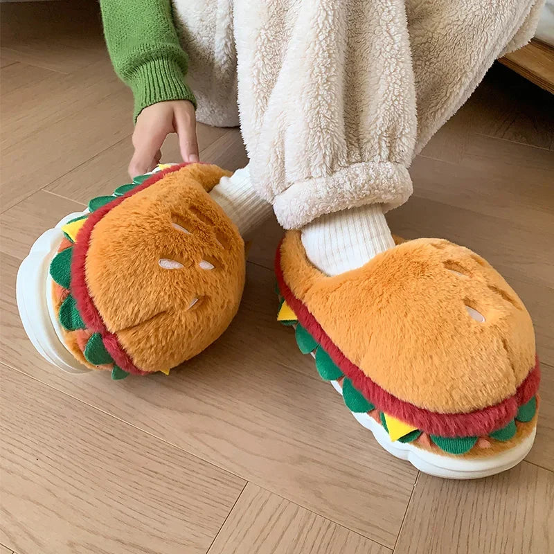Hamburger-shaped kawaii slippers worn by a person on a wooden floor.