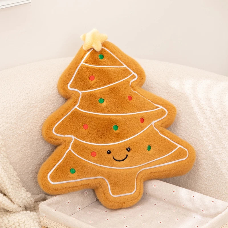 Kawaii plush gingerbread tree toy with a happy face on a soft surface