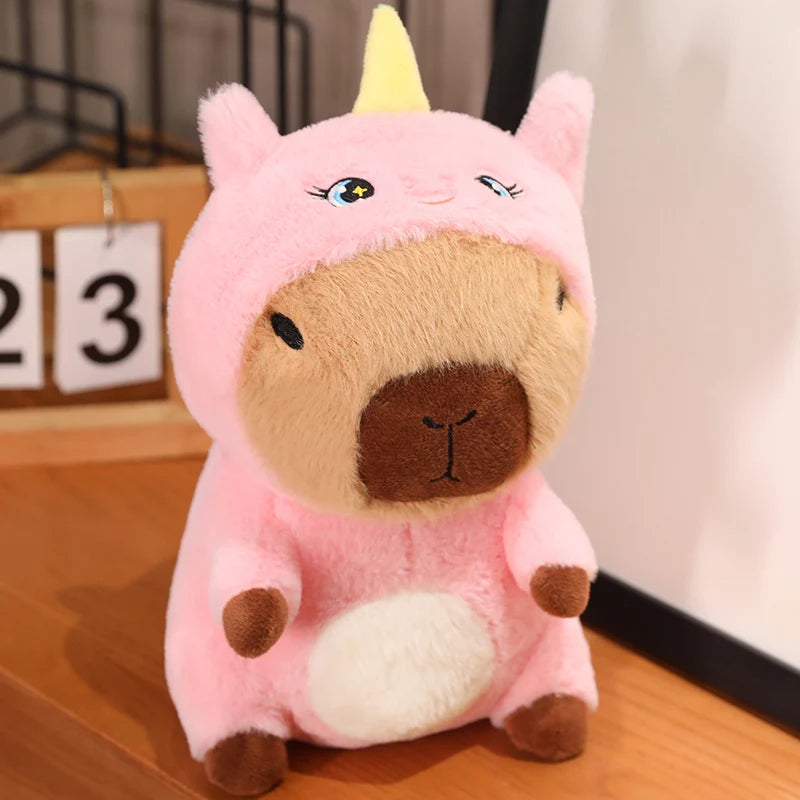 Kawaii plush toy with pink and brown design on a wooden surface