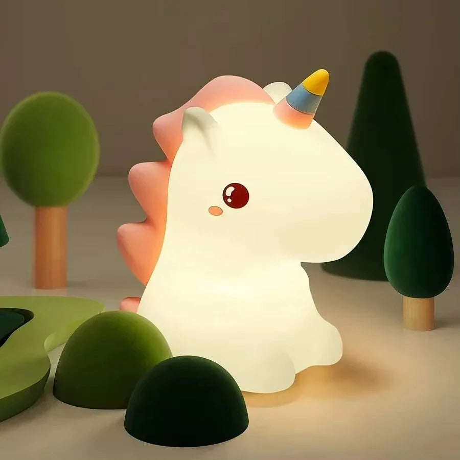 Kawaii unicorn-shaped night light with a soft glow in a forest setting