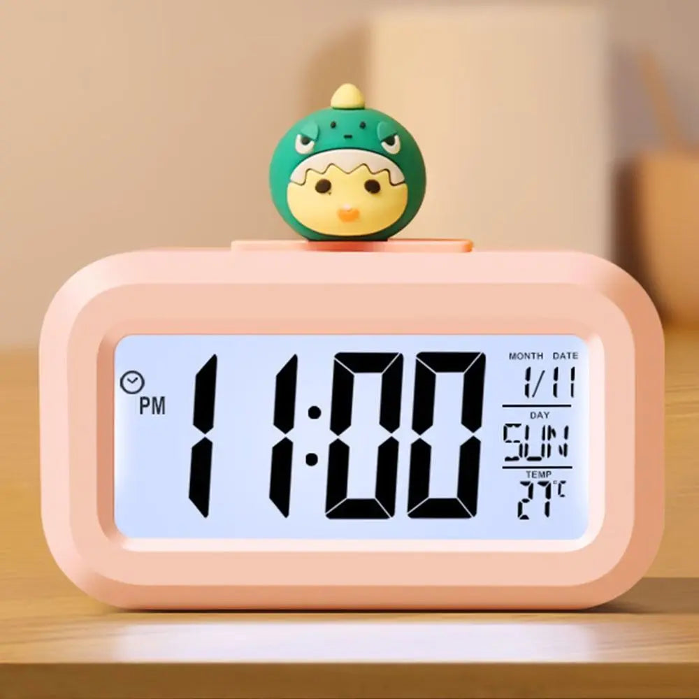 Kawaii digital clock with a cartoon character on top, displaying time and date.