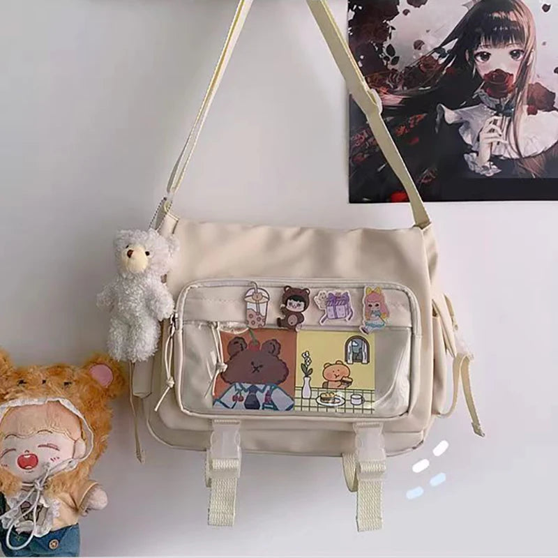 Beige Kawaii crossbody bag with cartoon character designs on a white background