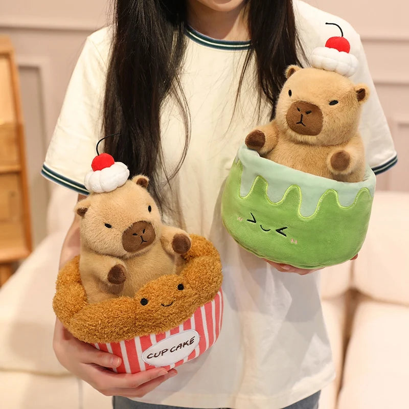 Person holding two cute kawaii plush toys shaped like bears in cake and ice cream forms.